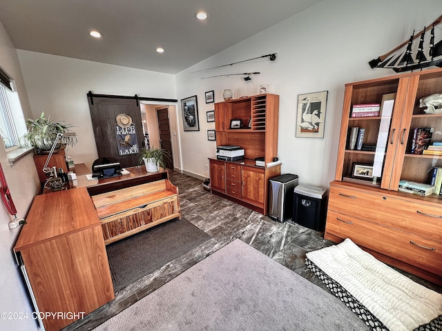 interior space with lofted ceiling, dark carpet, and a barn door