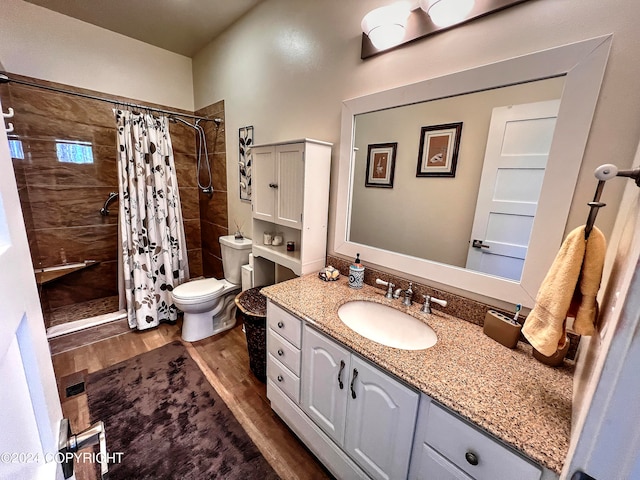 bathroom with curtained shower, wood-type flooring, toilet, and oversized vanity