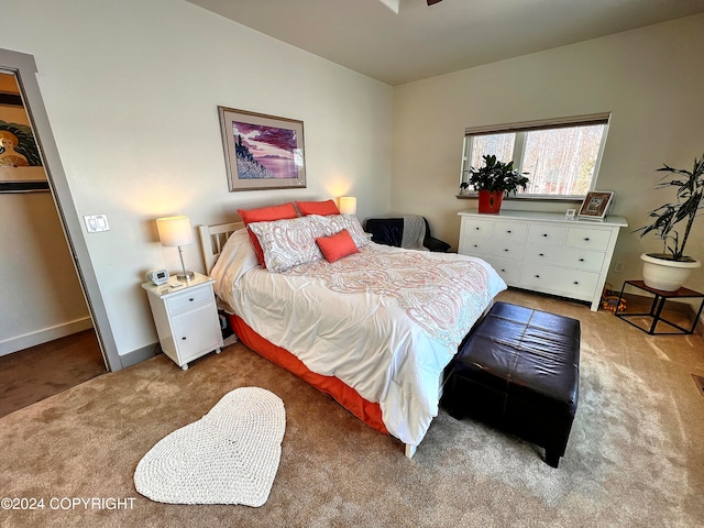 bedroom featuring light colored carpet