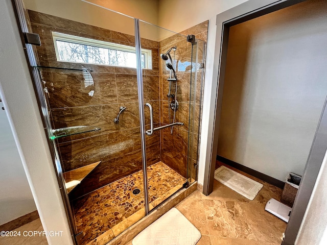 bathroom featuring walk in shower and tile floors