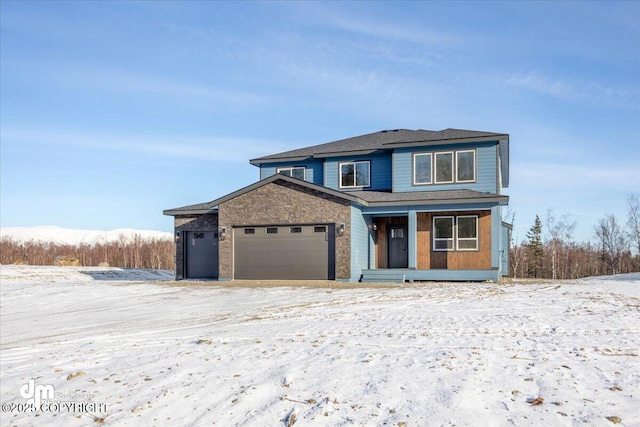 view of property with a porch and a garage