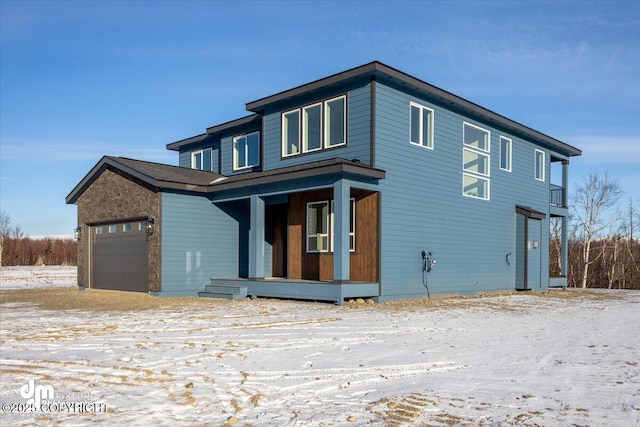 view of front facade featuring a garage and covered porch