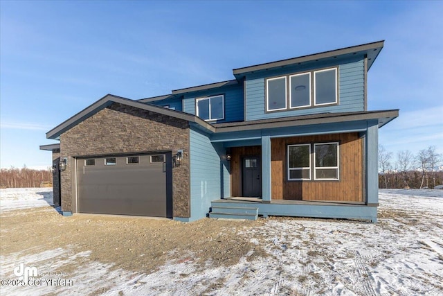 view of front of home with a garage and covered porch