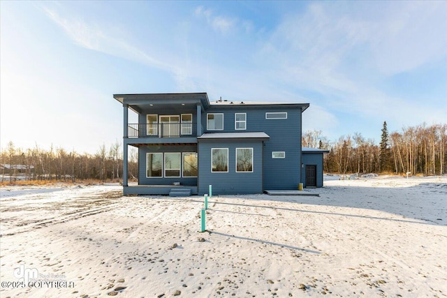 back of house with a balcony