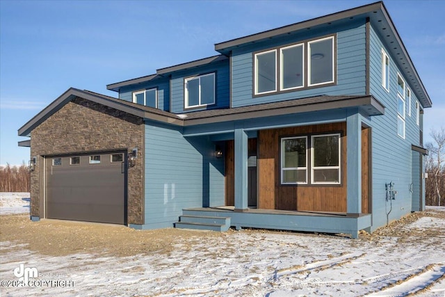 view of front of home featuring a garage and a porch