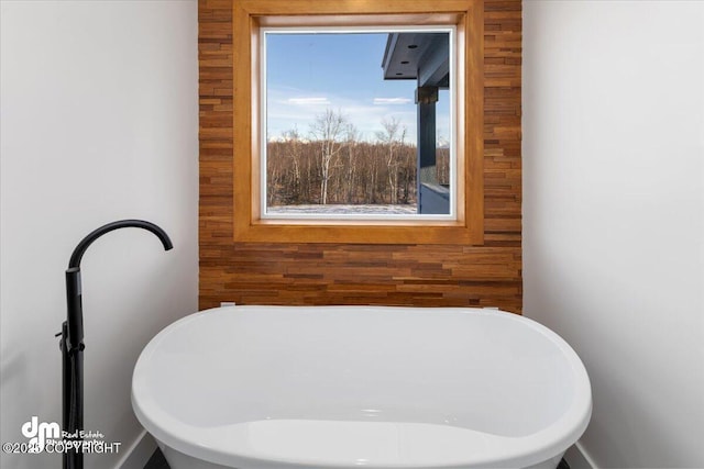 bathroom with a washtub