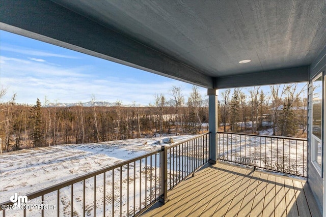 view of snow covered deck