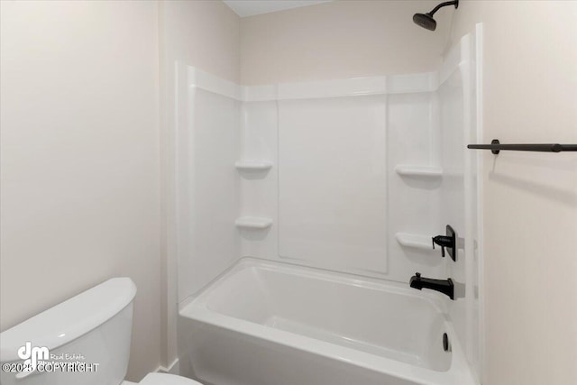 bathroom featuring bathing tub / shower combination and toilet