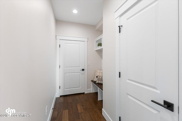 hall with dark hardwood / wood-style flooring