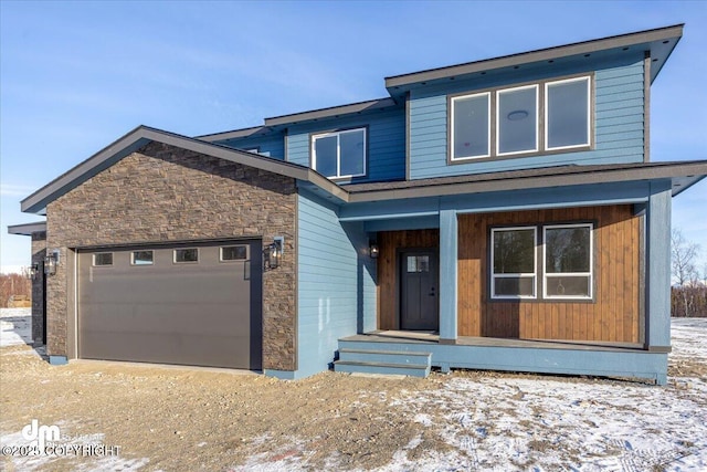 view of front facade featuring a garage and a porch