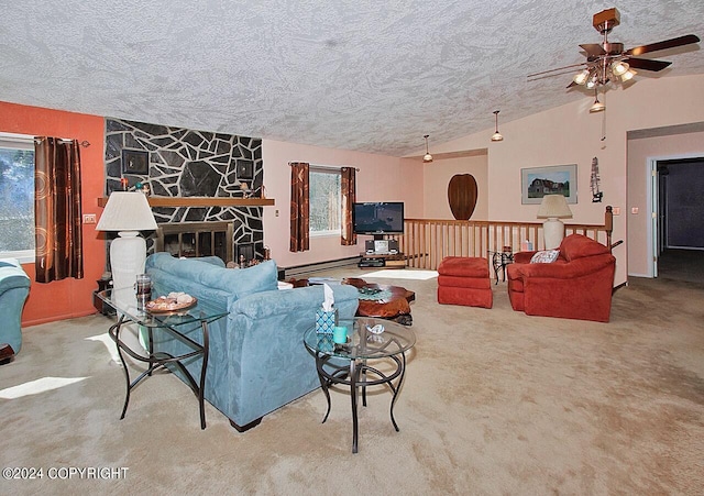 carpeted living room with a textured ceiling, ceiling fan, a baseboard radiator, a stone fireplace, and lofted ceiling