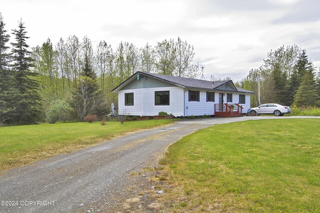 ranch-style home with a front yard