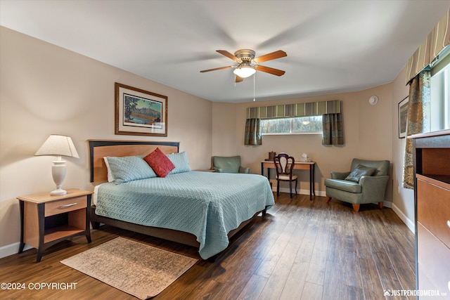 bedroom with dark wood-type flooring and ceiling fan