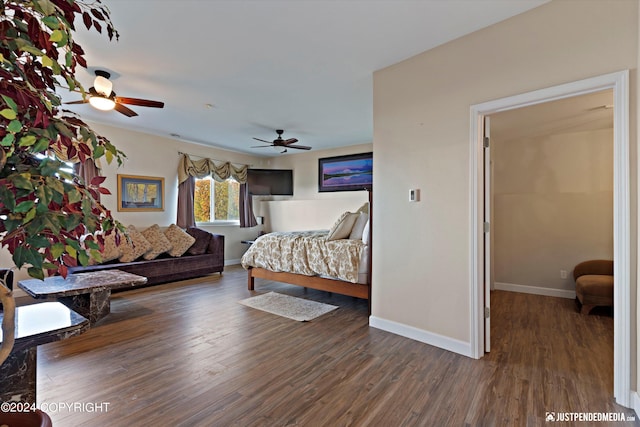 bedroom with dark wood-type flooring and ceiling fan