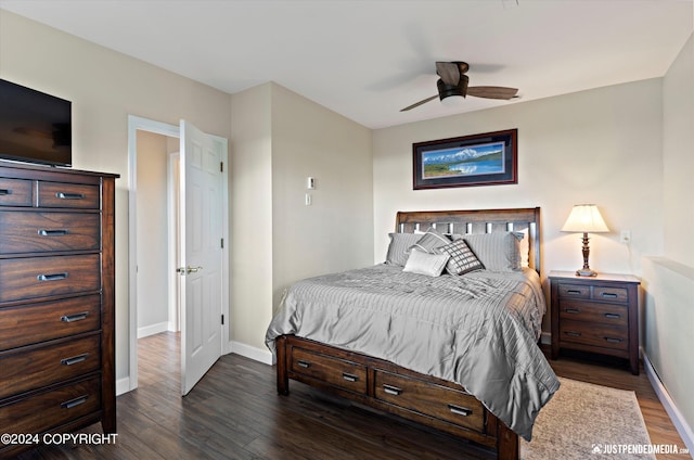 bedroom featuring ceiling fan and dark hardwood / wood-style floors