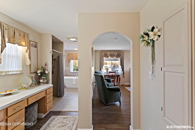 bathroom with separate shower and tub, wood-type flooring, and vanity