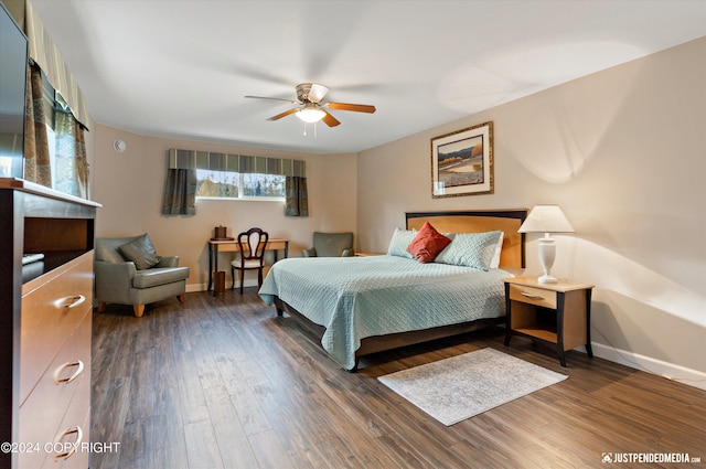 bedroom with ceiling fan and hardwood / wood-style flooring