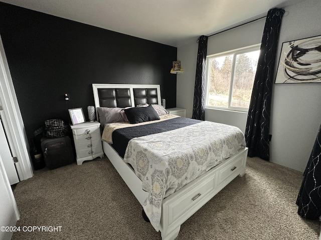 bedroom with light colored carpet