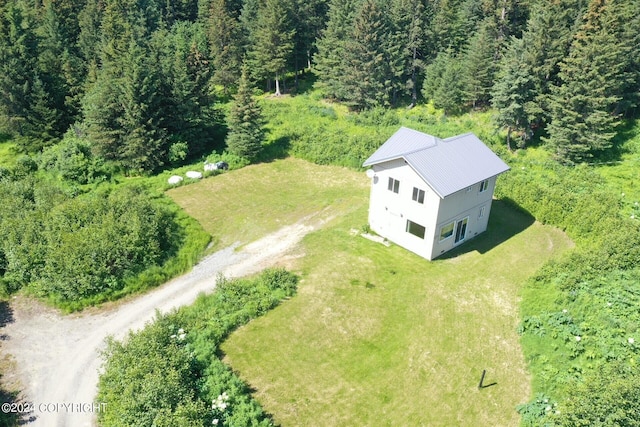 aerial view featuring a wooded view