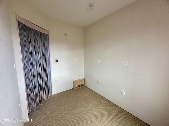 unfurnished room featuring carpet floors