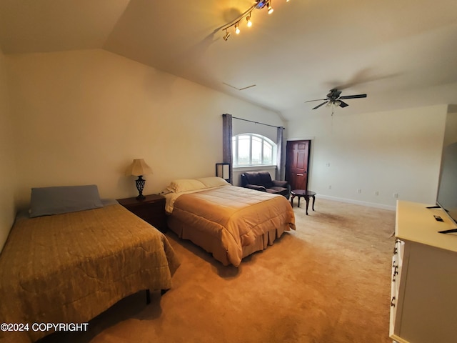 bedroom with lofted ceiling, rail lighting, carpet floors, and ceiling fan