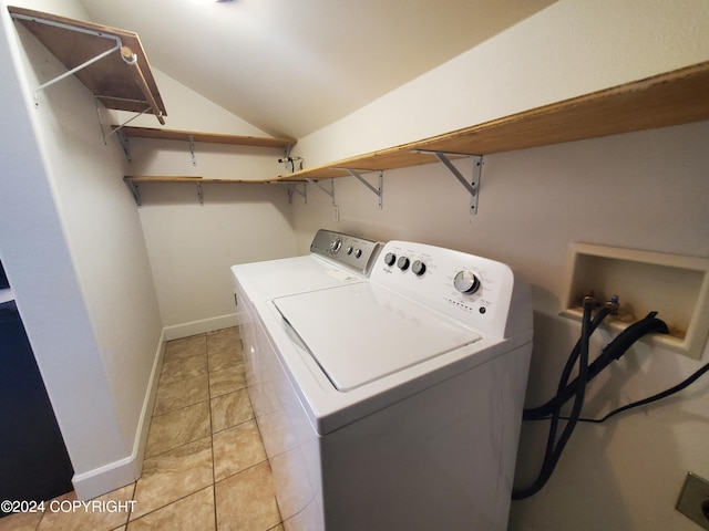 laundry area featuring light tile patterned flooring and independent washer and dryer