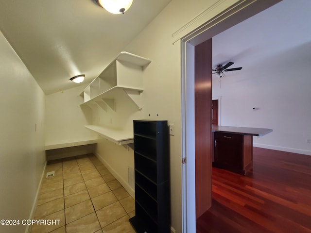 spacious closet featuring ceiling fan and light tile patterned floors