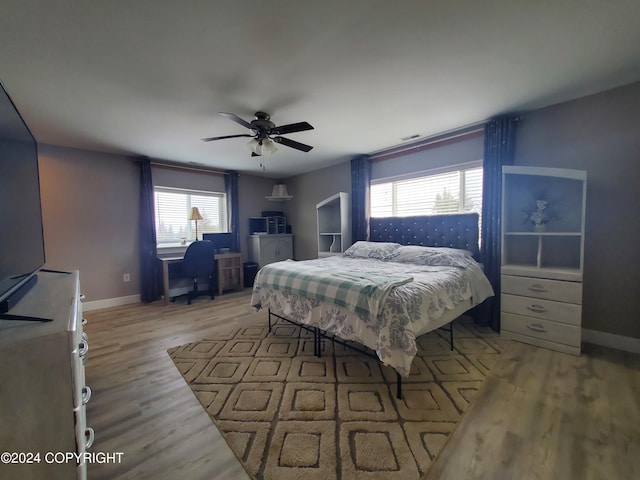 bedroom featuring light wood-type flooring and ceiling fan