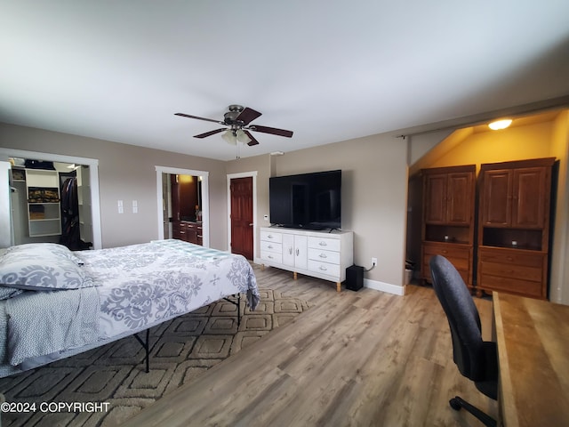 bedroom with ceiling fan and light hardwood / wood-style floors