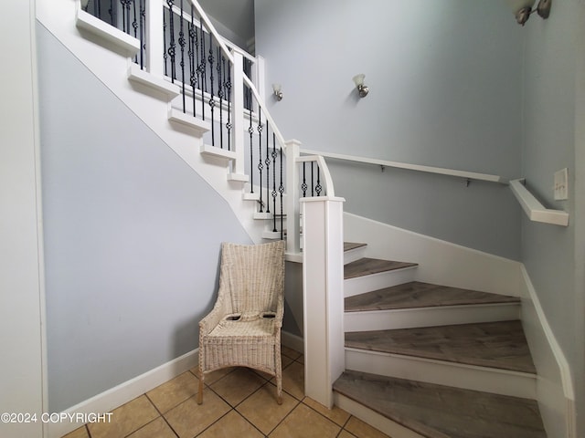 stairs with tile patterned flooring