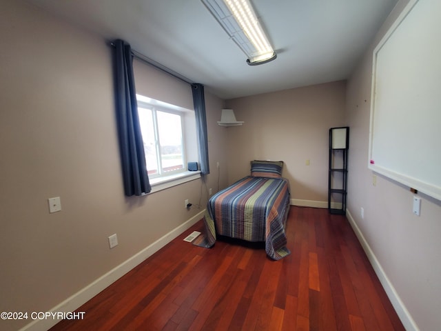 bedroom featuring dark wood-type flooring