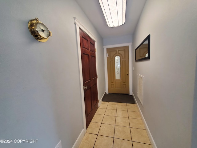 doorway featuring light tile patterned floors