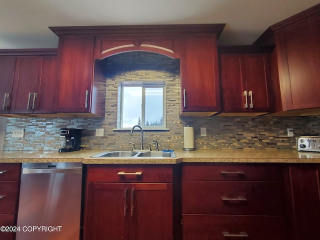 kitchen featuring sink, stainless steel dishwasher, and tasteful backsplash