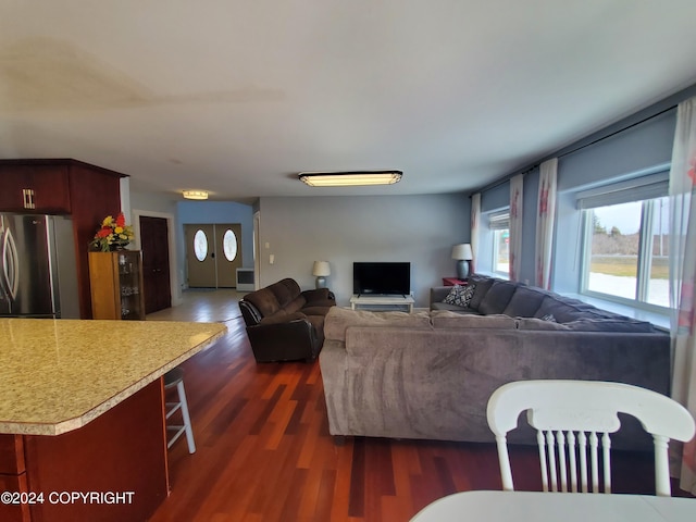 living room with dark hardwood / wood-style flooring