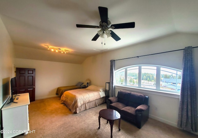 carpeted bedroom with lofted ceiling and ceiling fan