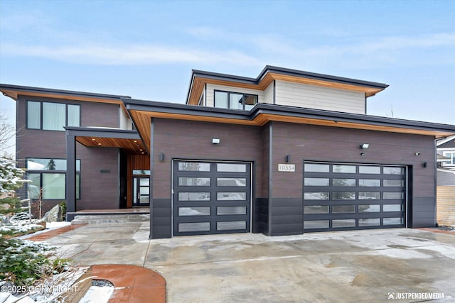 contemporary home featuring concrete driveway