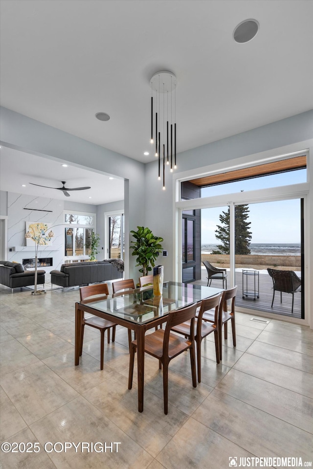 dining space featuring a ceiling fan and recessed lighting