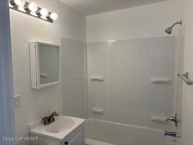 bathroom featuring shower / bathing tub combination and vanity