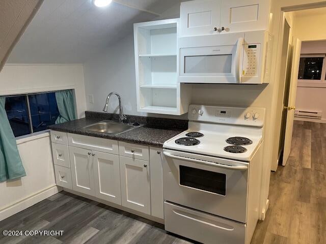 kitchen with white cabinets, sink, white appliances, and dark hardwood / wood-style flooring