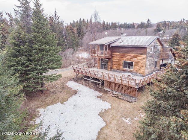 back of house with a wooden deck