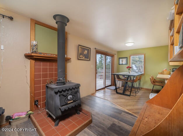 living room featuring hardwood / wood-style floors and a wood stove