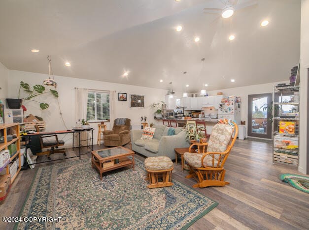 living room featuring high vaulted ceiling, hardwood / wood-style floors, and ceiling fan