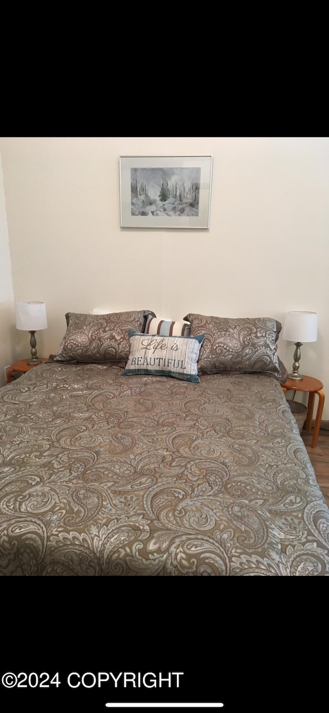 bedroom featuring hardwood / wood-style floors