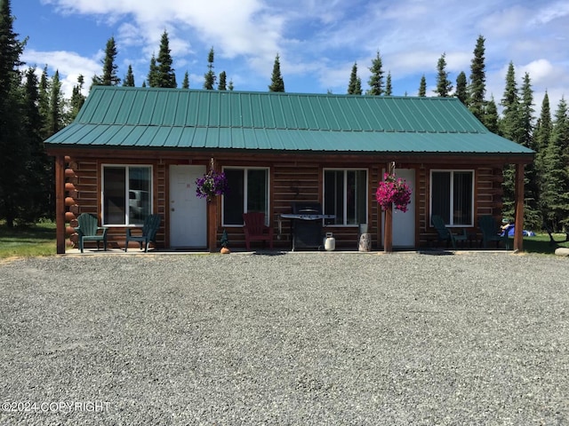 log cabin featuring a porch