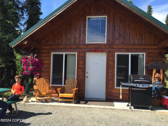 view of log cabin