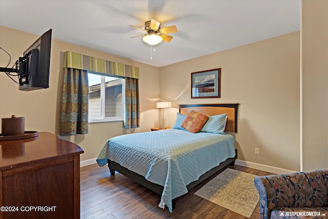 bedroom featuring ceiling fan and dark hardwood / wood-style flooring