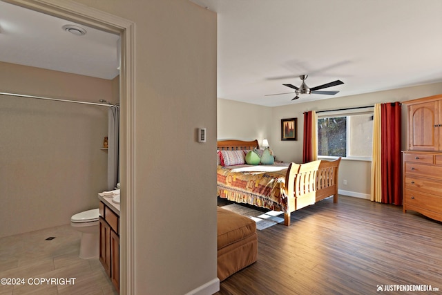 bedroom with hardwood / wood-style flooring and ceiling fan