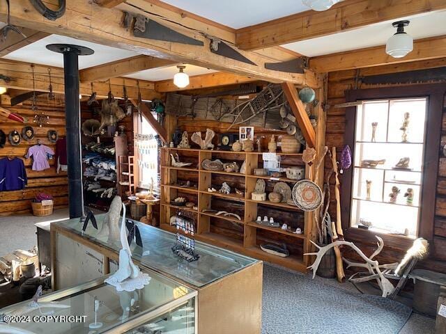 wine area with beamed ceiling