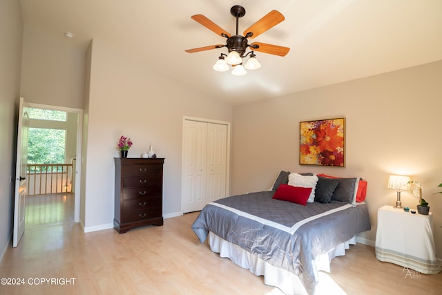 bedroom featuring lofted ceiling, a closet, ceiling fan, and hardwood / wood-style floors