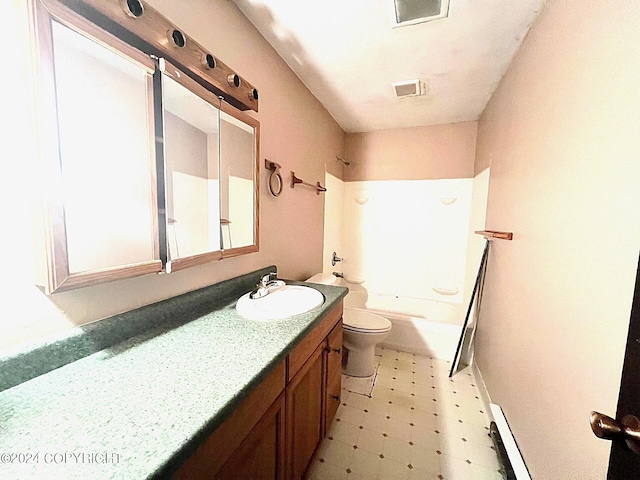 full bathroom featuring a baseboard heating unit,  shower combination, vanity, and toilet